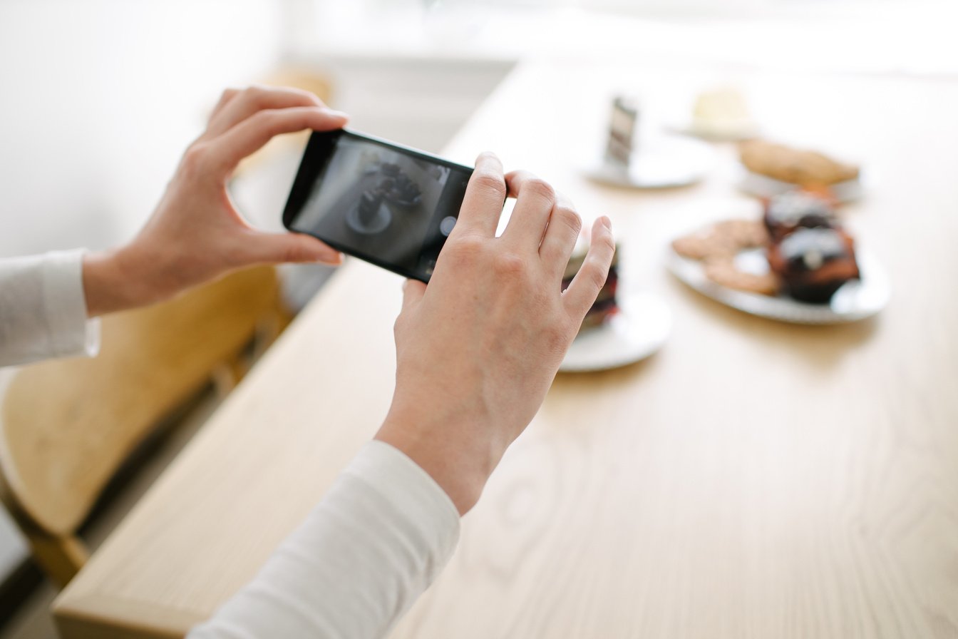 Female Vlogger Recording Food Content